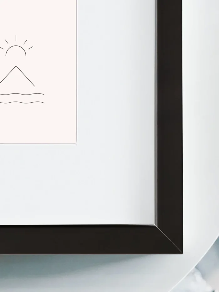 Close up of Horizon Mark framed art print showing white mat and black wood frame