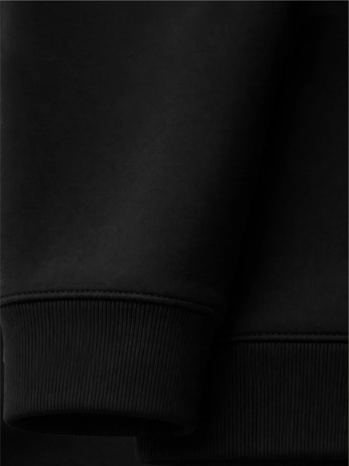 Close-up of 1x1 rib cuff and bottom hem on Black Ink organic cotton sweatshirt