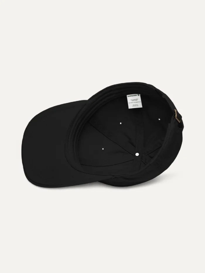 Inside view of black organic cotton twill cap showing inner panels and stitching