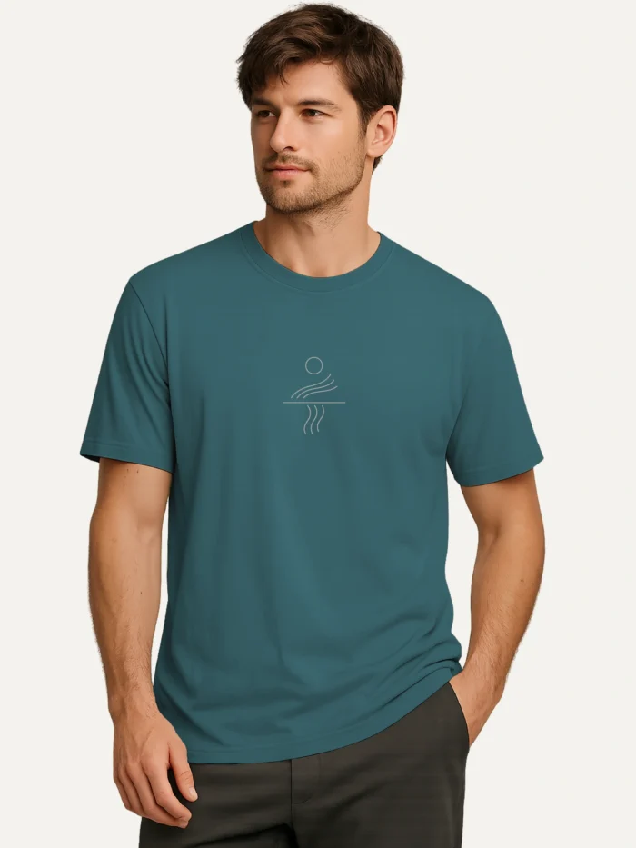man wearing stargazer blue organic cotton t-shirt with minimal solar current line artwork