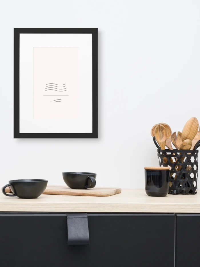 Framed wind flow study minimal line artwork displayed above kitchen counter in modern interior