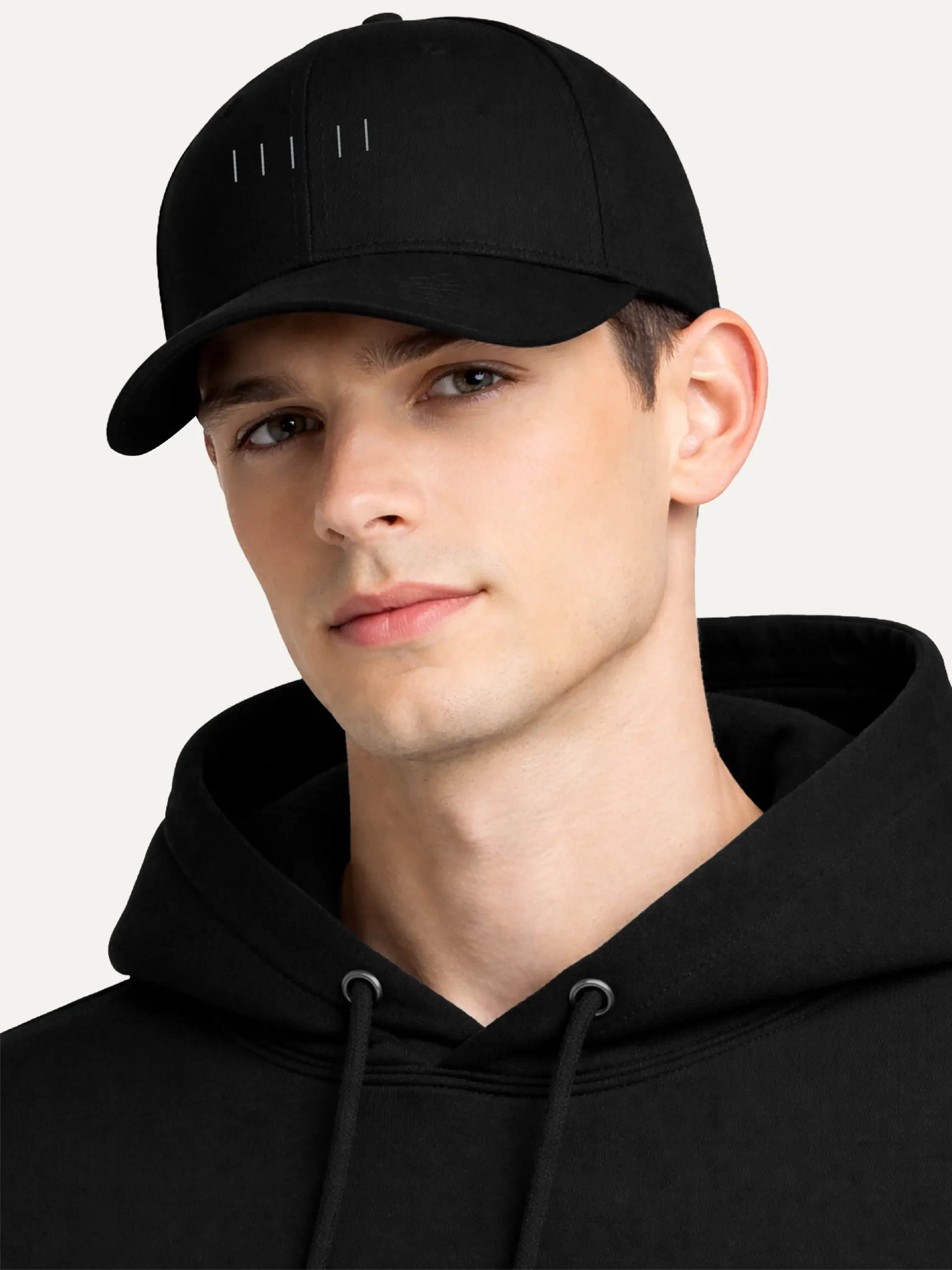 Male model wearing black Seasonal Index embroidered cap