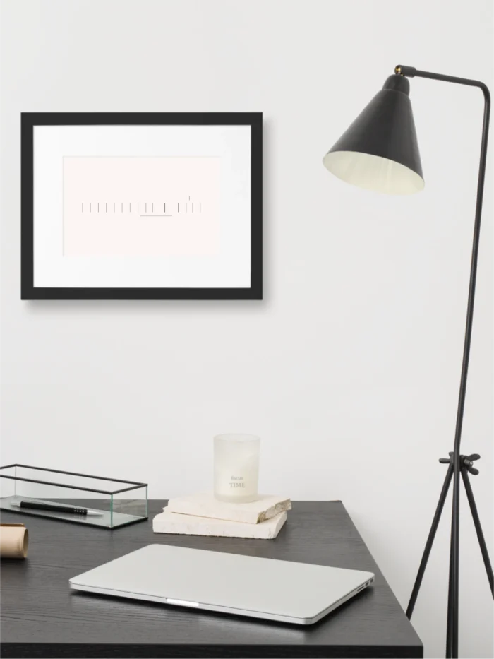 Seasonal Index framed art displayed above a minimal home workspace