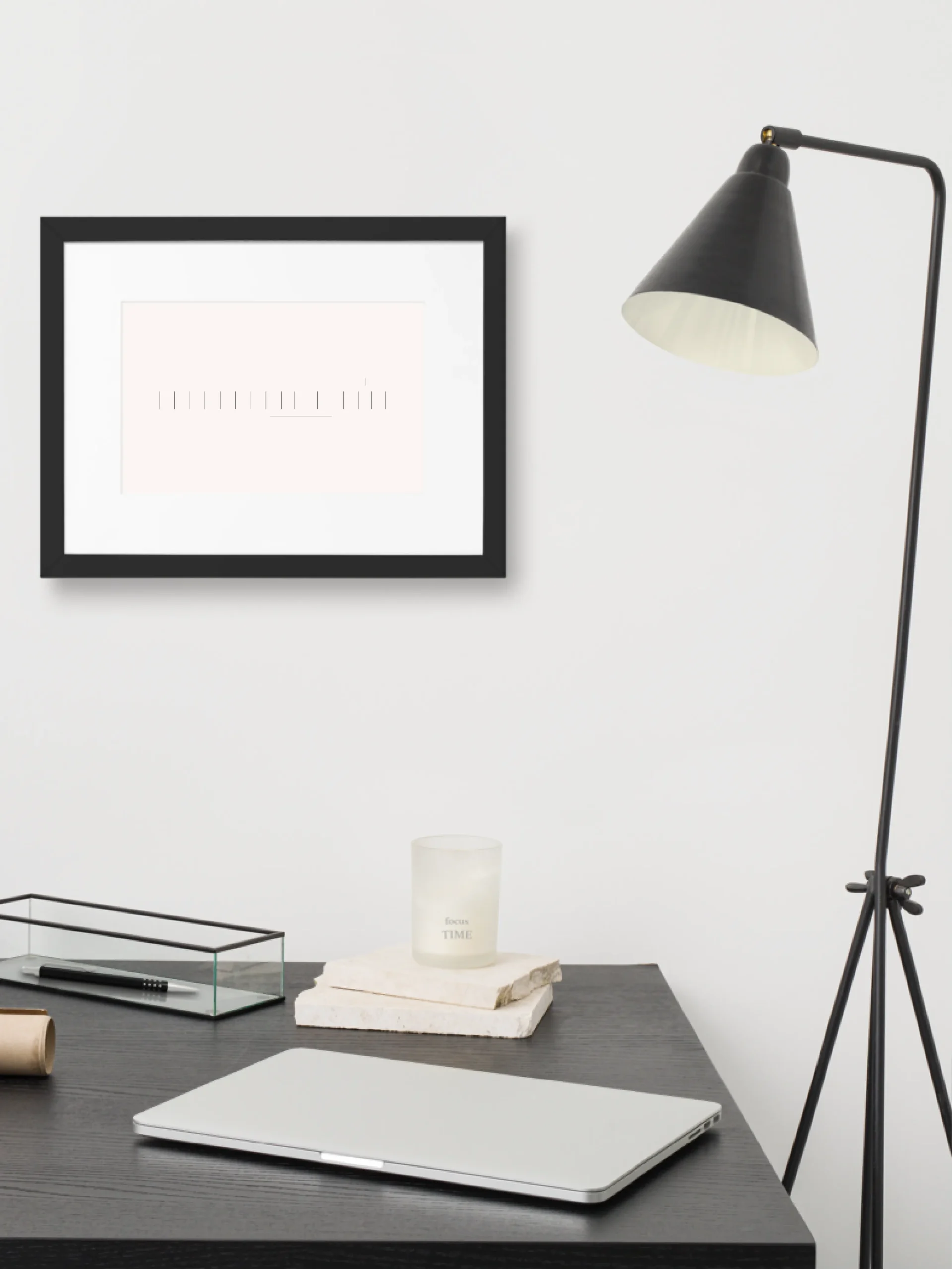 Seasonal Index framed art displayed above a minimal home workspace