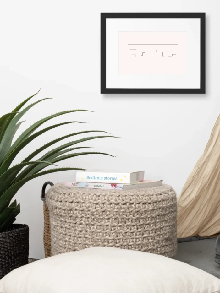 Held Insert framed art print displayed above a woven side stool