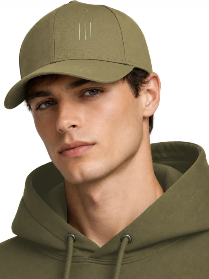 Male model wearing Jungle Material Lineage embroidered cap