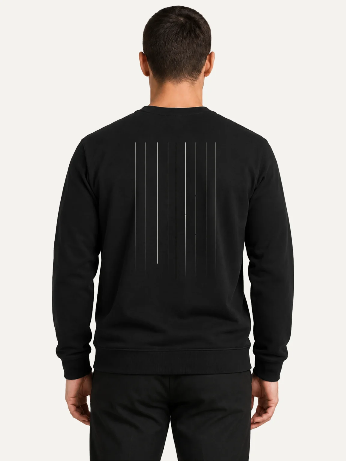 Male model wearing black Material Lineage sweatshirt from the back