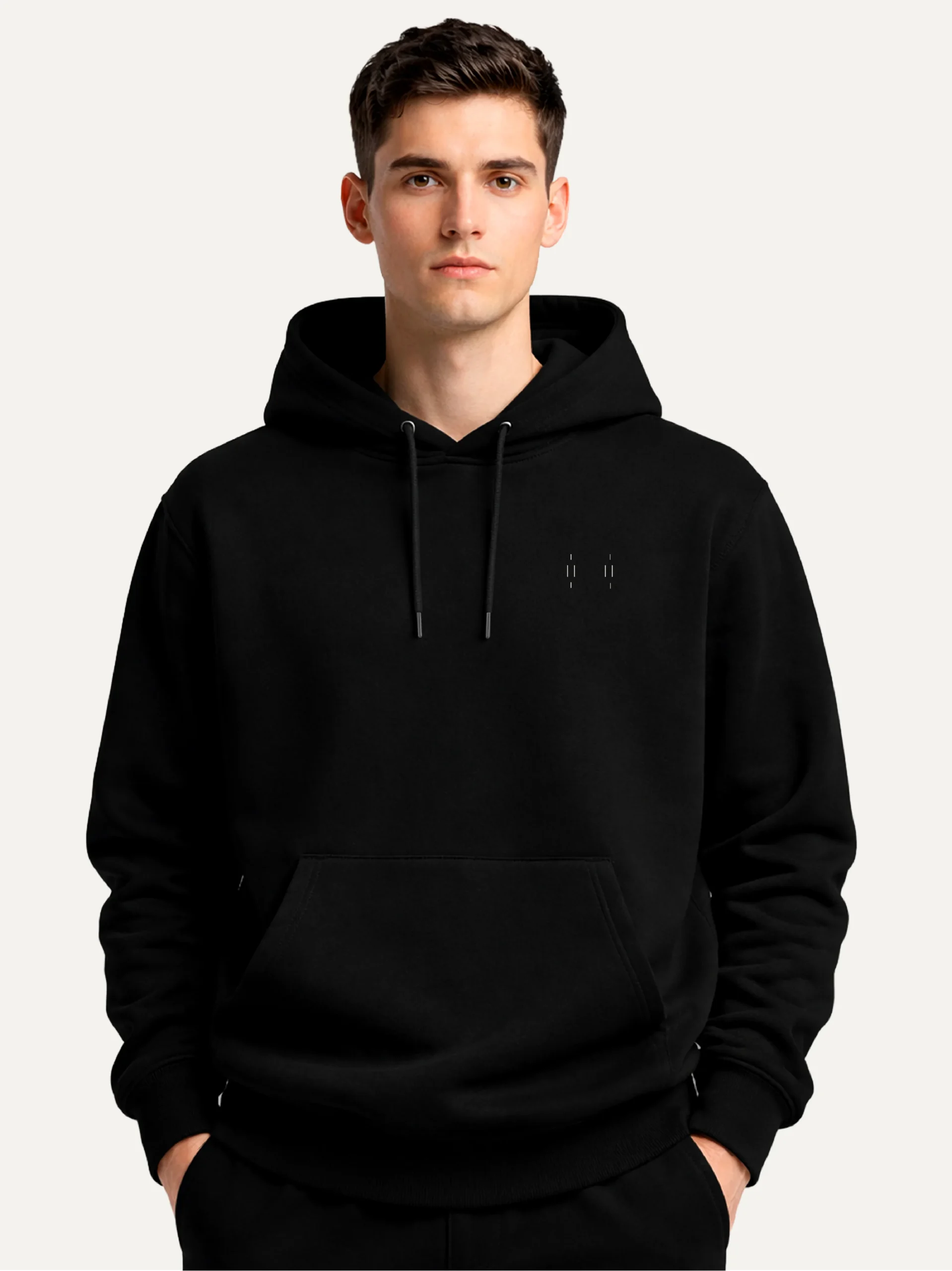 Model wearing black Memory Relay hoodie with minimal Stone White chest detail