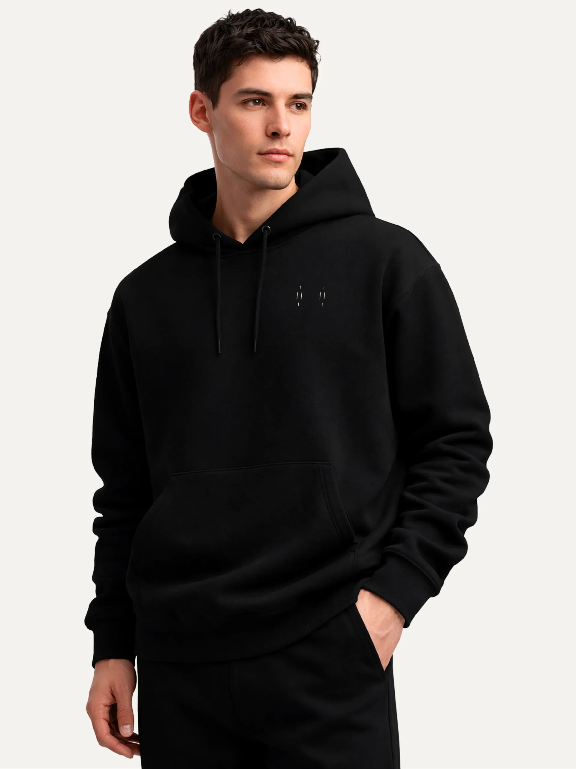 Three-quarter view of model wearing black Memory Relay organic cotton hoodie
