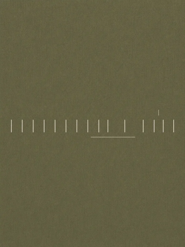 Close-up of Stone White Seasonal Index print on Khaki Soil cotton