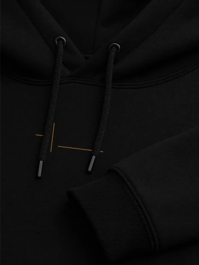 Displaced Ground Organic Cotton Hoodie — Black close-up showing the double-layer hood, drawcords, metal tips, kangaroo pocket and ribbed construction.