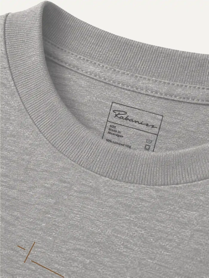 Displaced Ground Organic Cotton T-Shirt — Heather Grey, close-up of the ribbed collar and inside label.