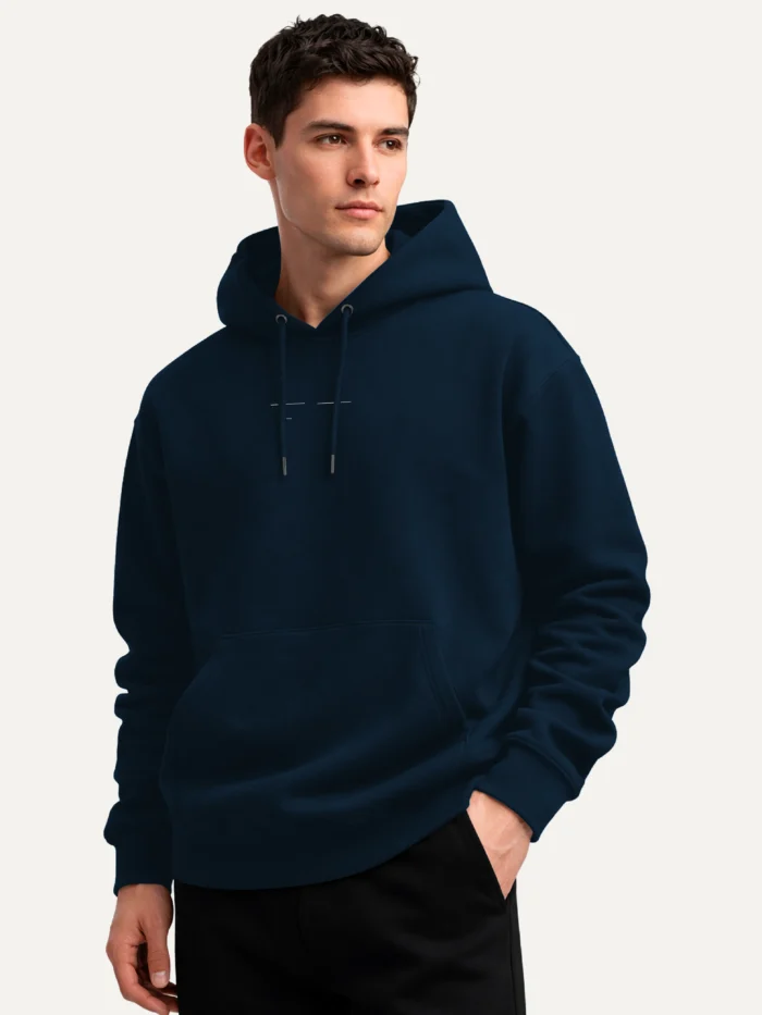 Model wearing French Navy Return Interval hoodie at an angle
