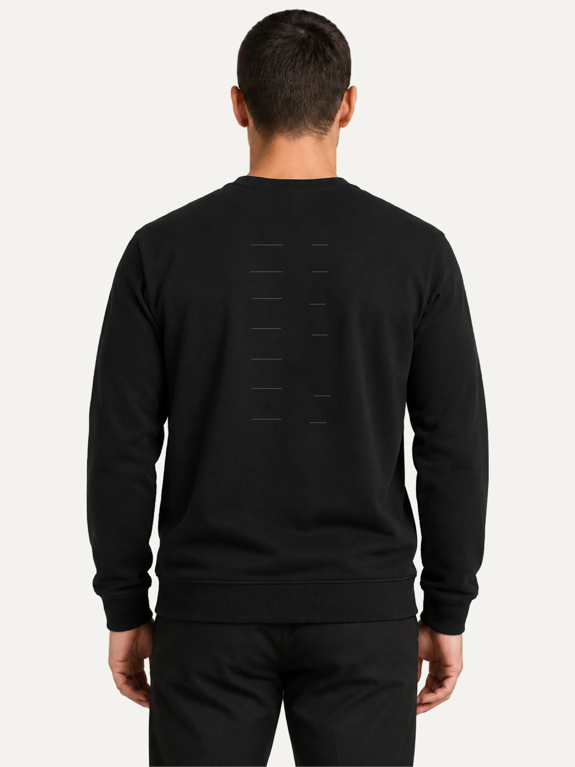 Model wearing black Seasonal Drift sweatshirt from the back