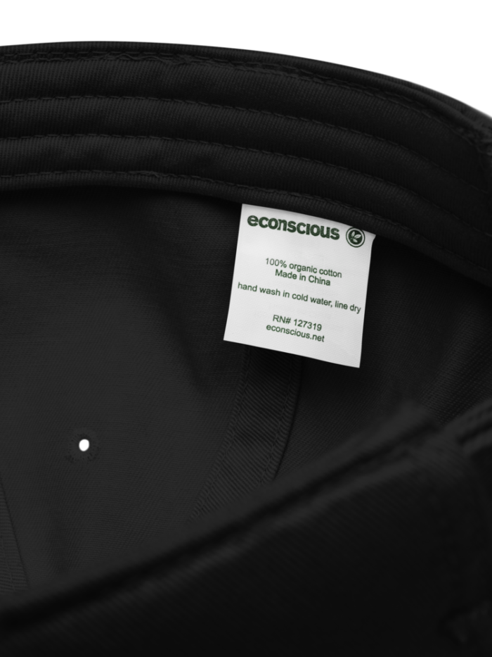 Black cap interior close-up showing organic cotton label and stitched sweatband