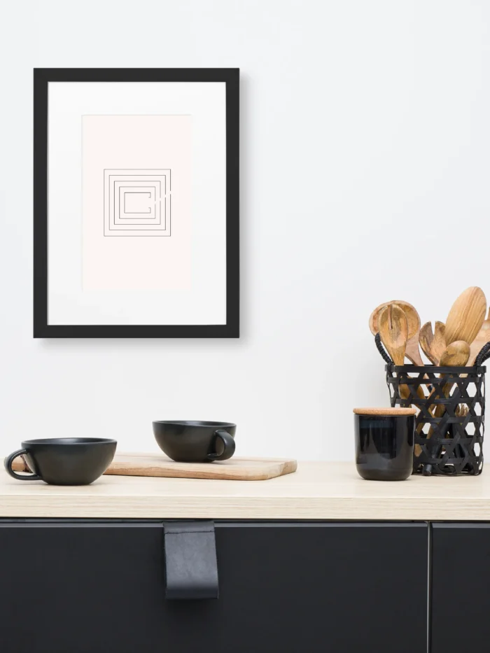 Second Look framed artwork above kitchen counter with black cups and wooden utensils