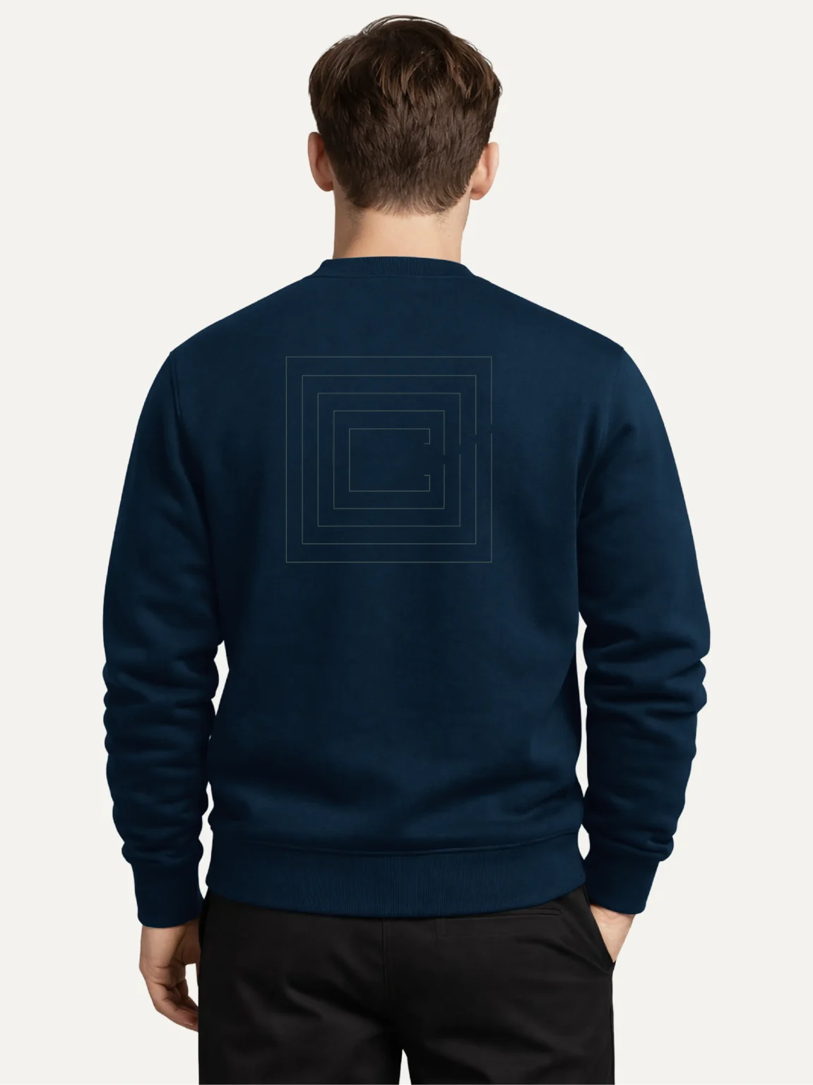 Model wearing a French Navy Second Look organic cotton sweatshirt, viewed from behind with nested contour artwork on the back.