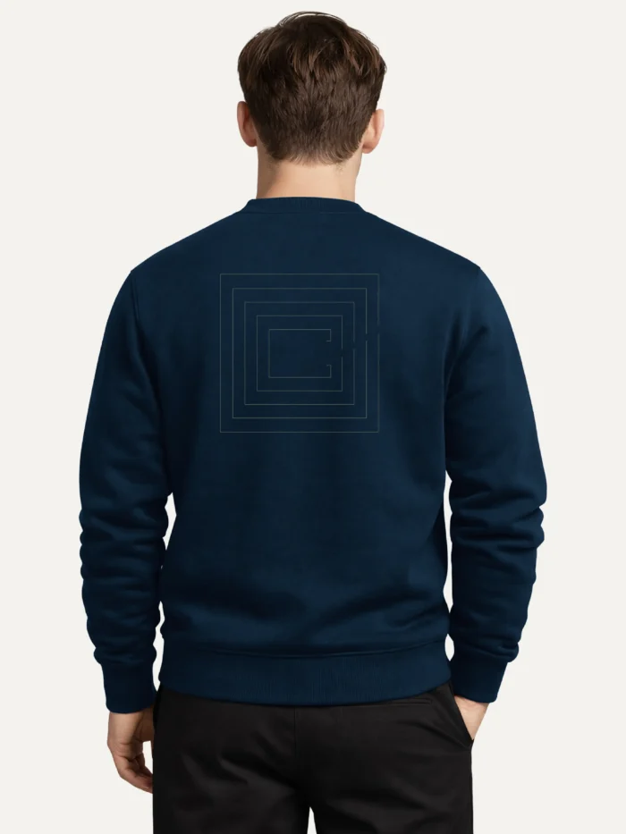 Model wearing a French Navy Second Look organic cotton sweatshirt, viewed from behind with nested contour artwork on the back.